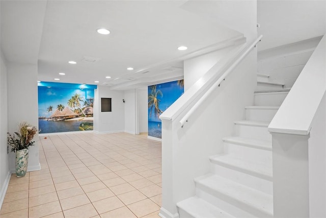 staircase with baseboards, tile patterned flooring, and recessed lighting