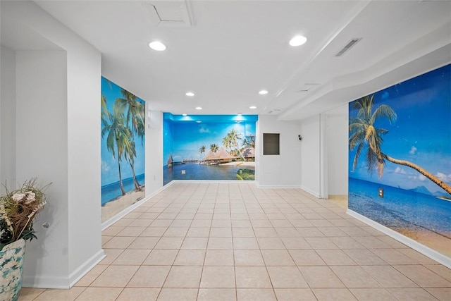 tiled spare room featuring baseboards, visible vents, and recessed lighting