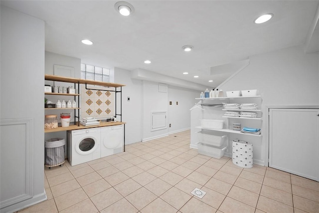 laundry room featuring light tile patterned floors, laundry area, washer and dryer, and recessed lighting