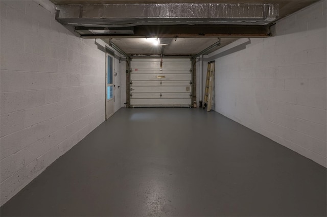 garage featuring concrete block wall