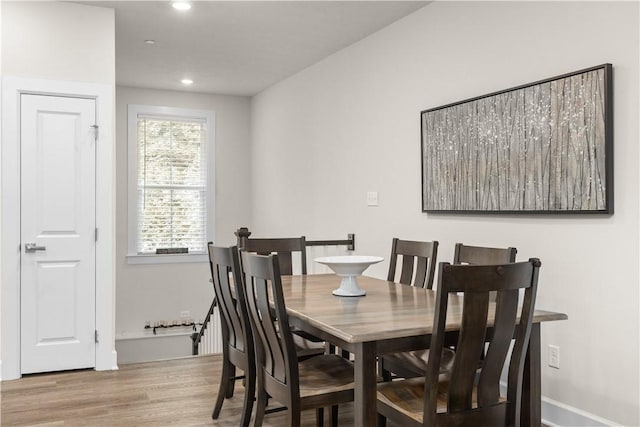 dining space featuring recessed lighting and wood finished floors