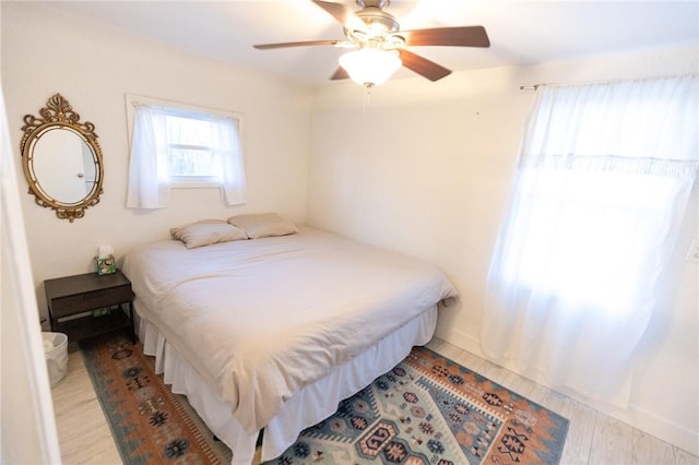 bedroom featuring ceiling fan and wood finished floors