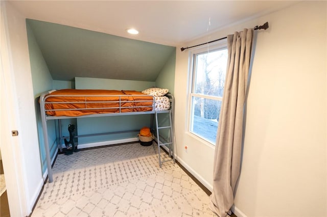 bedroom featuring lofted ceiling, recessed lighting, and baseboards