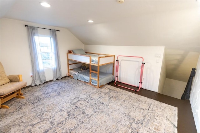 unfurnished bedroom with vaulted ceiling and recessed lighting