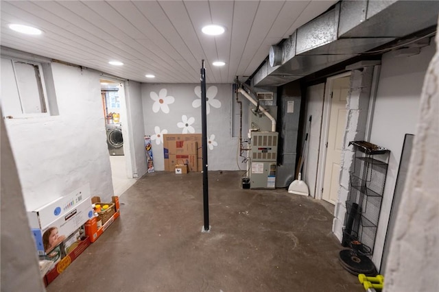 basement with washer / clothes dryer and recessed lighting