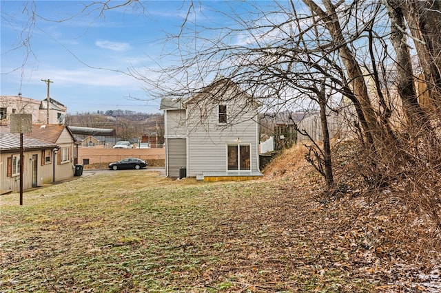 view of property exterior with a yard