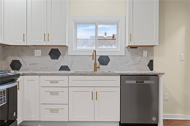 kitchen with black range with electric stovetop, white cabinets, a sink, and stainless steel dishwasher