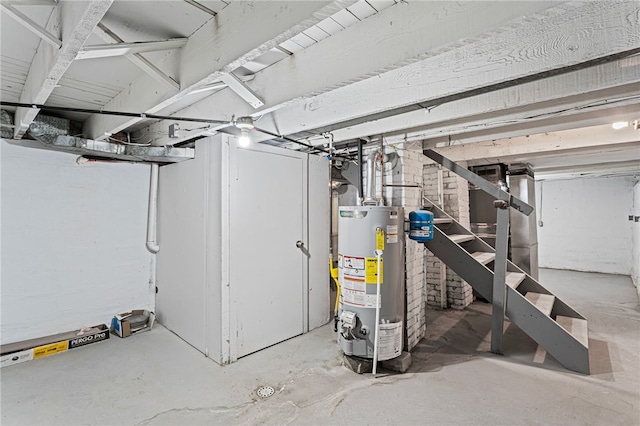 unfinished below grade area featuring gas water heater