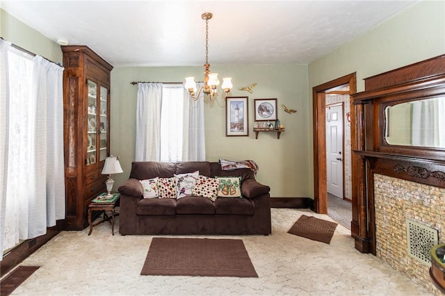 living area with carpet floors, baseboards, and an inviting chandelier