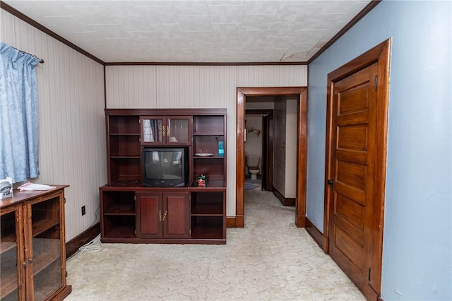 office area with light carpet, baseboards, and ornamental molding