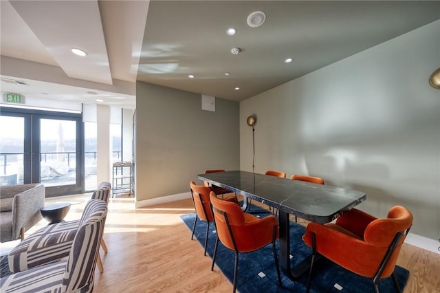 dining space with light wood-type flooring, visible vents, baseboards, and recessed lighting