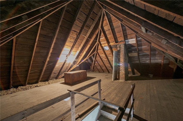 attic featuring an upstairs landing