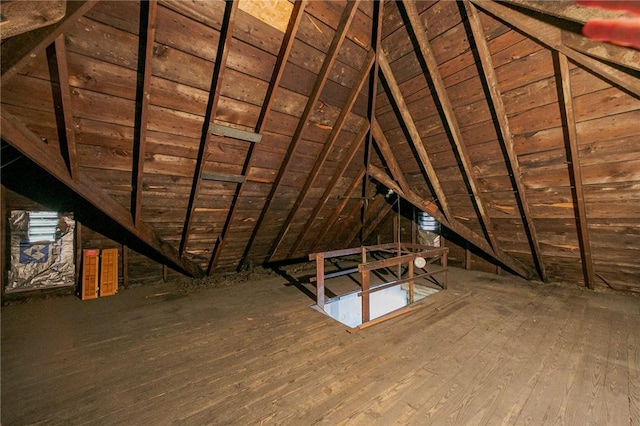 attic featuring an upstairs landing