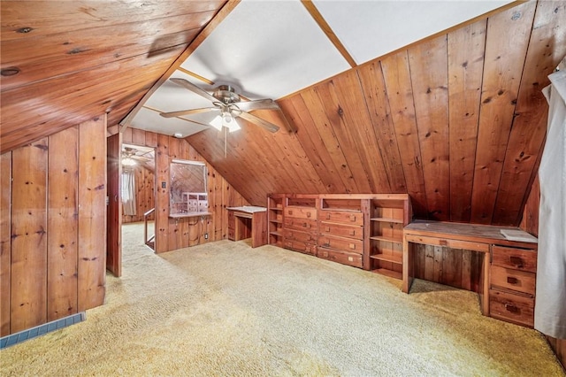 bonus room with carpet, wood ceiling, vaulted ceiling, and wooden walls