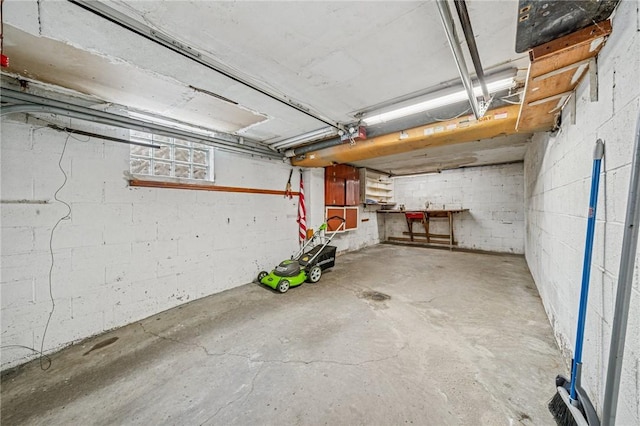 garage with concrete block wall