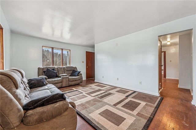 living area with wood finished floors and baseboards