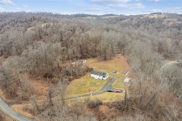 drone / aerial view with a forest view and a rural view