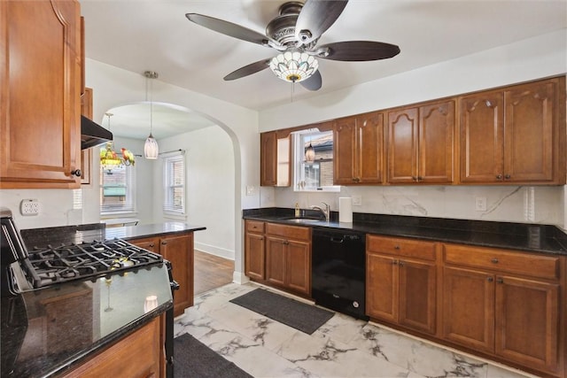 kitchen with arched walkways, a sink, black dishwasher, marble finish floor, and hanging light fixtures