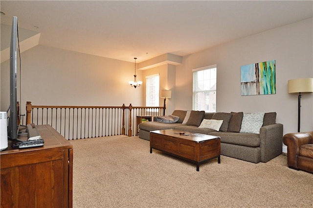 living room with carpet floors and a notable chandelier