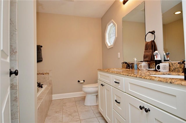 full bath featuring toilet, a garden tub, double vanity, and a sink