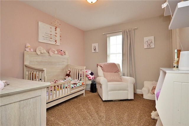 bedroom with carpet flooring and baseboards