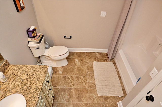 full bathroom with baseboards and toilet