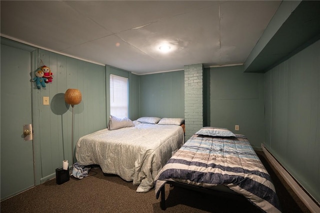 bedroom with carpet floors and a baseboard radiator