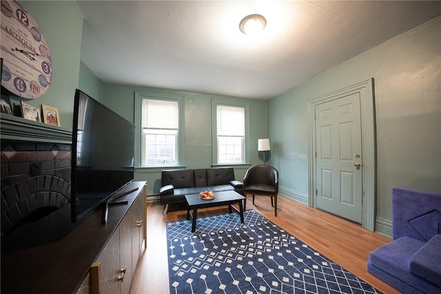 living room featuring baseboards and wood finished floors