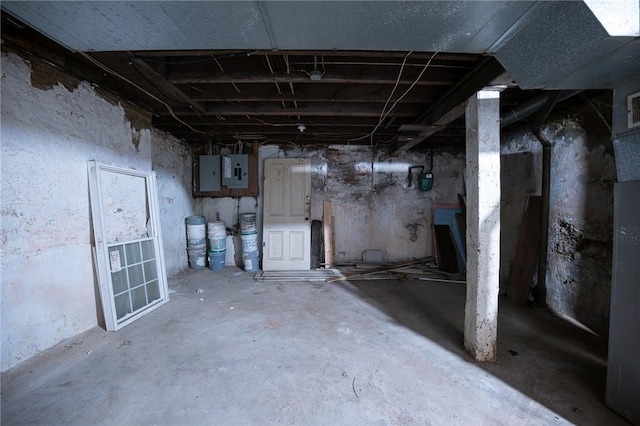 unfinished basement with visible vents and electric panel