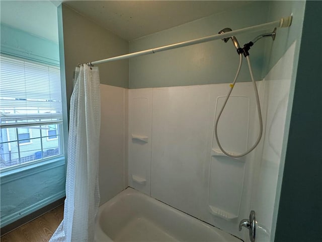 bathroom with shower / bathtub combination with curtain