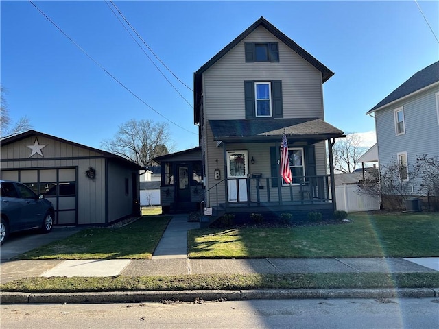 traditional-style home featuring a front yard, covered porch, an outbuilding, and central air condition unit