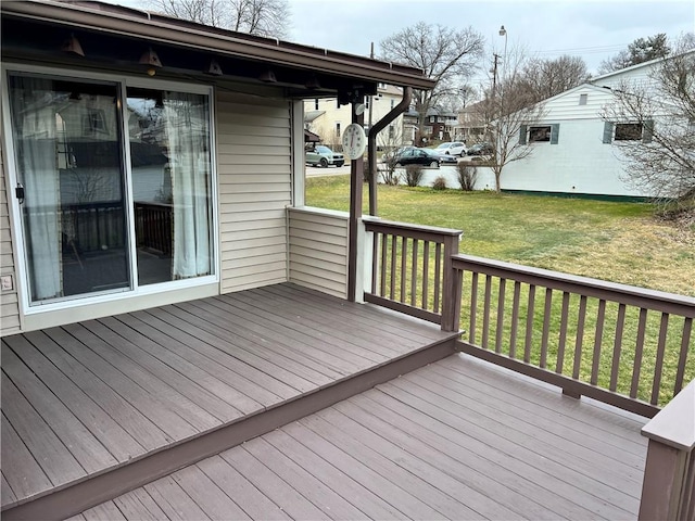 wooden deck with a lawn