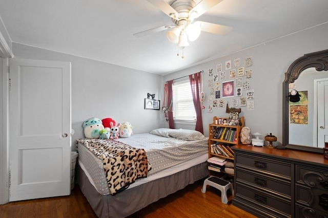 bedroom with ceiling fan and wood finished floors