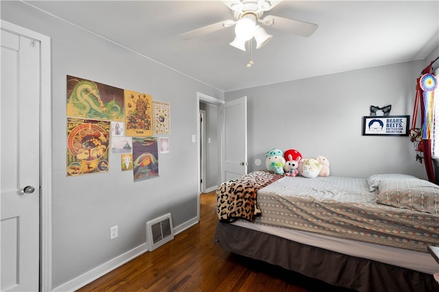 bedroom with visible vents, ceiling fan, baseboards, and wood finished floors