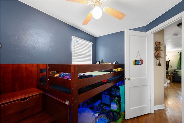 bedroom featuring ceiling fan and wood finished floors