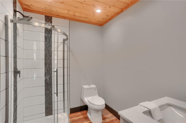 bathroom with wooden ceiling, toilet, wood finished floors, baseboards, and a shower stall