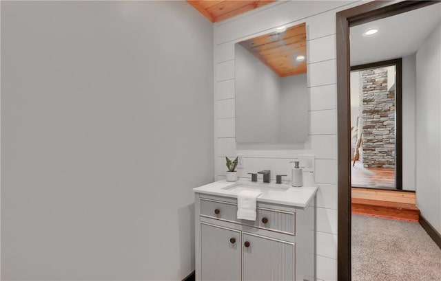 bathroom with recessed lighting and vanity