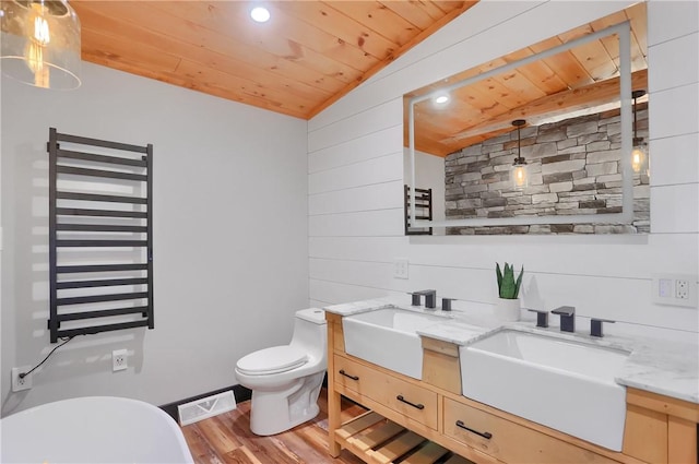 bathroom featuring toilet, wood ceiling, visible vents, vaulted ceiling, and radiator