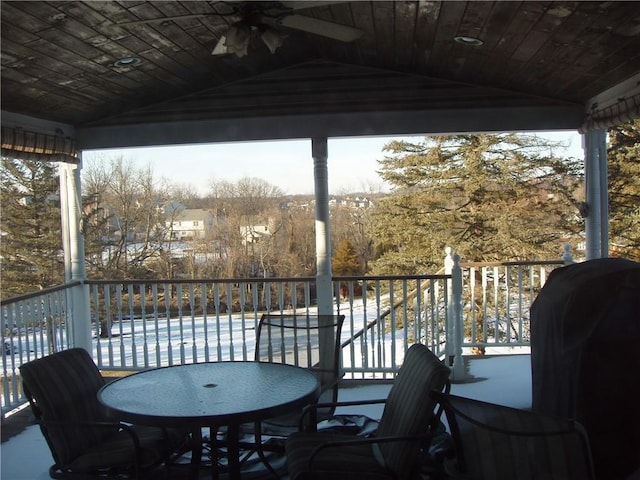 wooden deck featuring grilling area and an outdoor pool