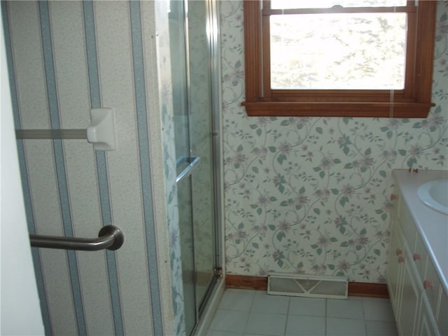 full bath with wallpapered walls, tile patterned flooring, visible vents, and a stall shower