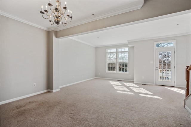 unfurnished room with carpet floors, baseboards, ornamental molding, and a notable chandelier