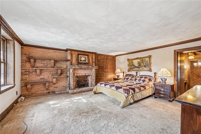 bedroom with carpet floors, ornamental molding, a textured ceiling, and baseboards