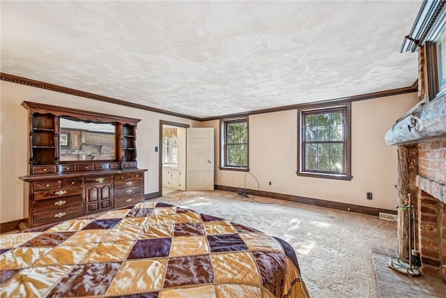 bedroom featuring a brick fireplace, baseboards, a textured ceiling, and carpet flooring