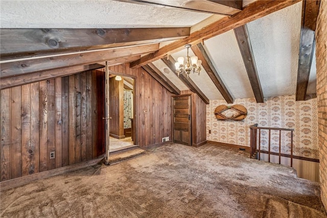 additional living space featuring vaulted ceiling with beams, carpet, a chandelier, and wooden walls