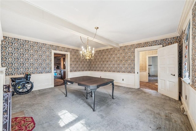 interior space with carpet floors, a wainscoted wall, crown molding, and wallpapered walls