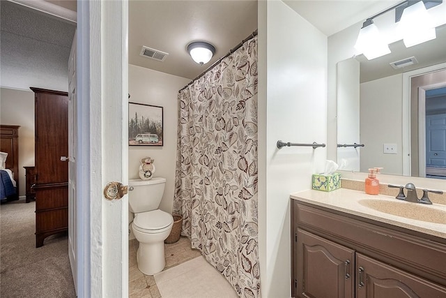 full bathroom with toilet, visible vents, and vanity