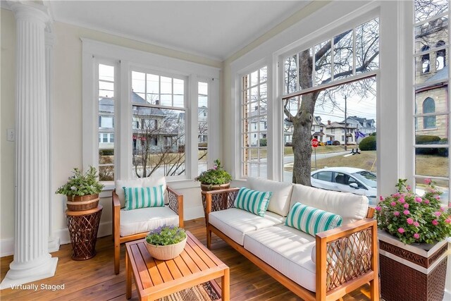 sunroom featuring ornate columns