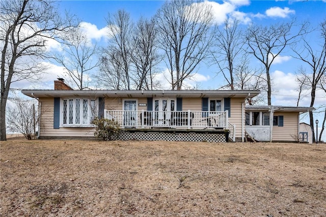 165 Mcelroy Rd, Sugarcreek Twp, PA 16028 - rear view of house with a wooden deck and a chimney