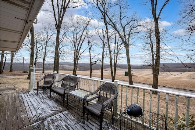 wooden terrace with a rural view