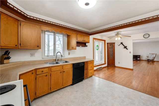 kitchen featuring black dishwasher, white electric stove, light countertops, and a sink